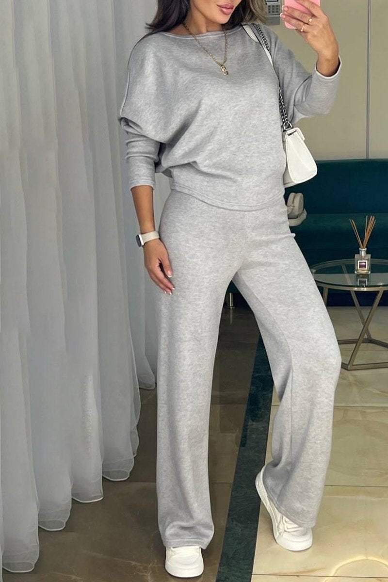 Naiste komplekt asümmeetrilise pluusi ja vabaaja pükstega